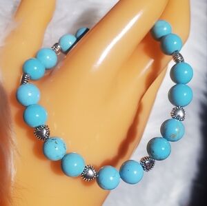 Turquoise and heart bracelet.